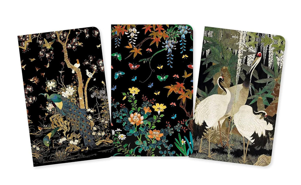 Three decorative notebooks with nature-themed designs on a white background