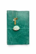 emerald chrome-tanned leather tri fold journal with a a large chrysoprase stone talisman. Featuring a bookmark with a trio of charms - clover, namaste, ohm symbol.
