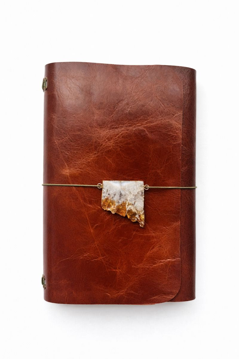 Solar Gate Ritual A5 Journal - rich golden brown chrome tan leather with a high gloss finish. Mossy green cording and a natural citrine druzy cut front charm.