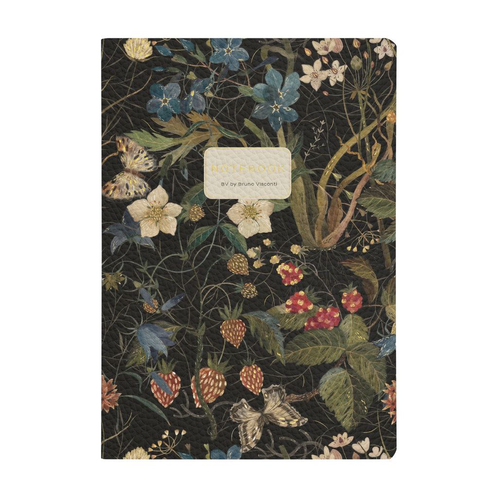 Notebook with floral design on a black background